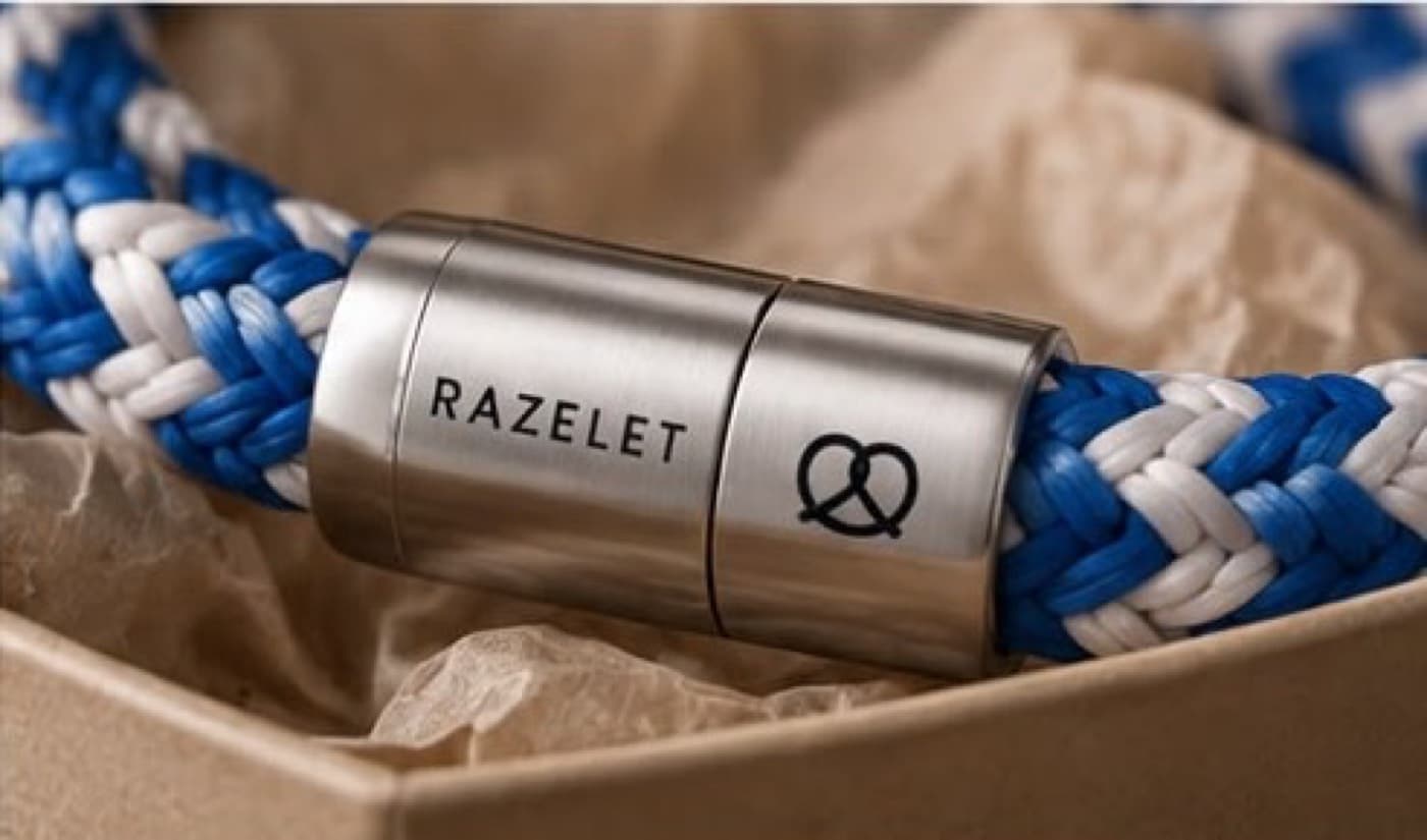 Stainless steel clasp with RAZELET engraving on a blue and white bracelet